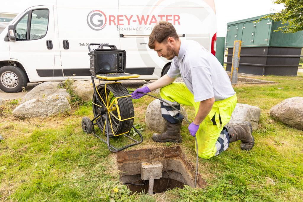 Chris uses a CCTV drain camera to inspect a manhole in Greenwich.