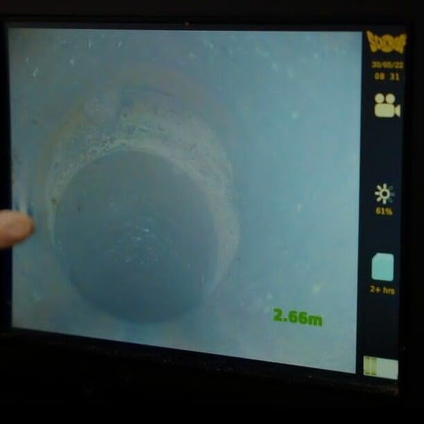 CCTV drainage survey being undertaken. The screen shows the inside of a drain.